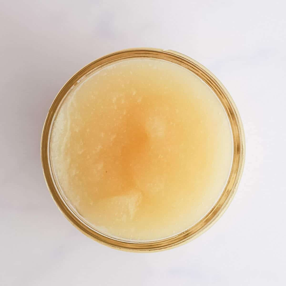 Top view of an open jar filled with Irish Sea Moss on a white background. The texture appears smooth and granular.