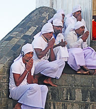 Buddhist monks praying on the summit of