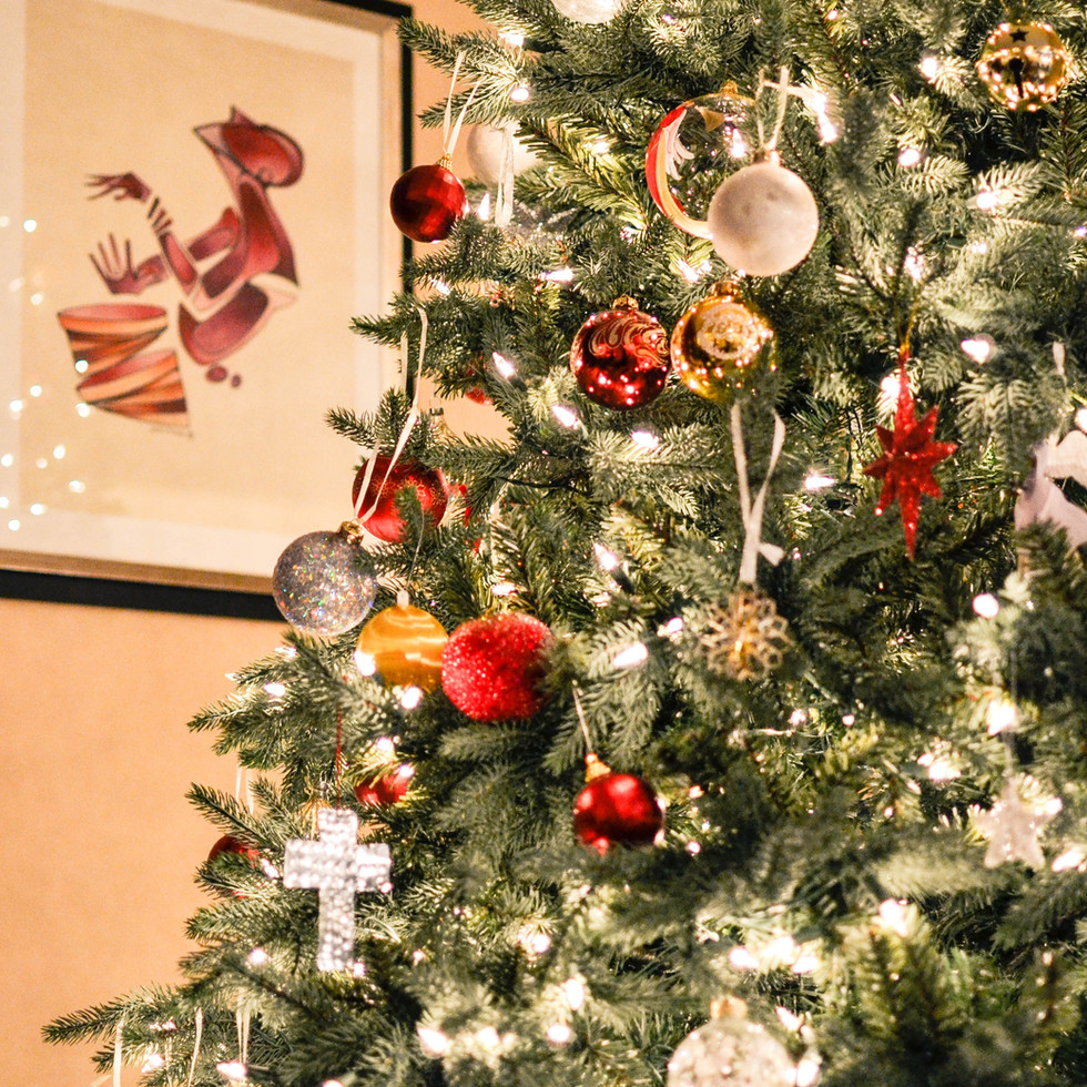 Up close view of Christmas tree with red, gold and silver ornaments