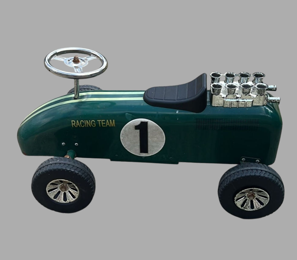 A Vintage GOKI Ride On Toy Car