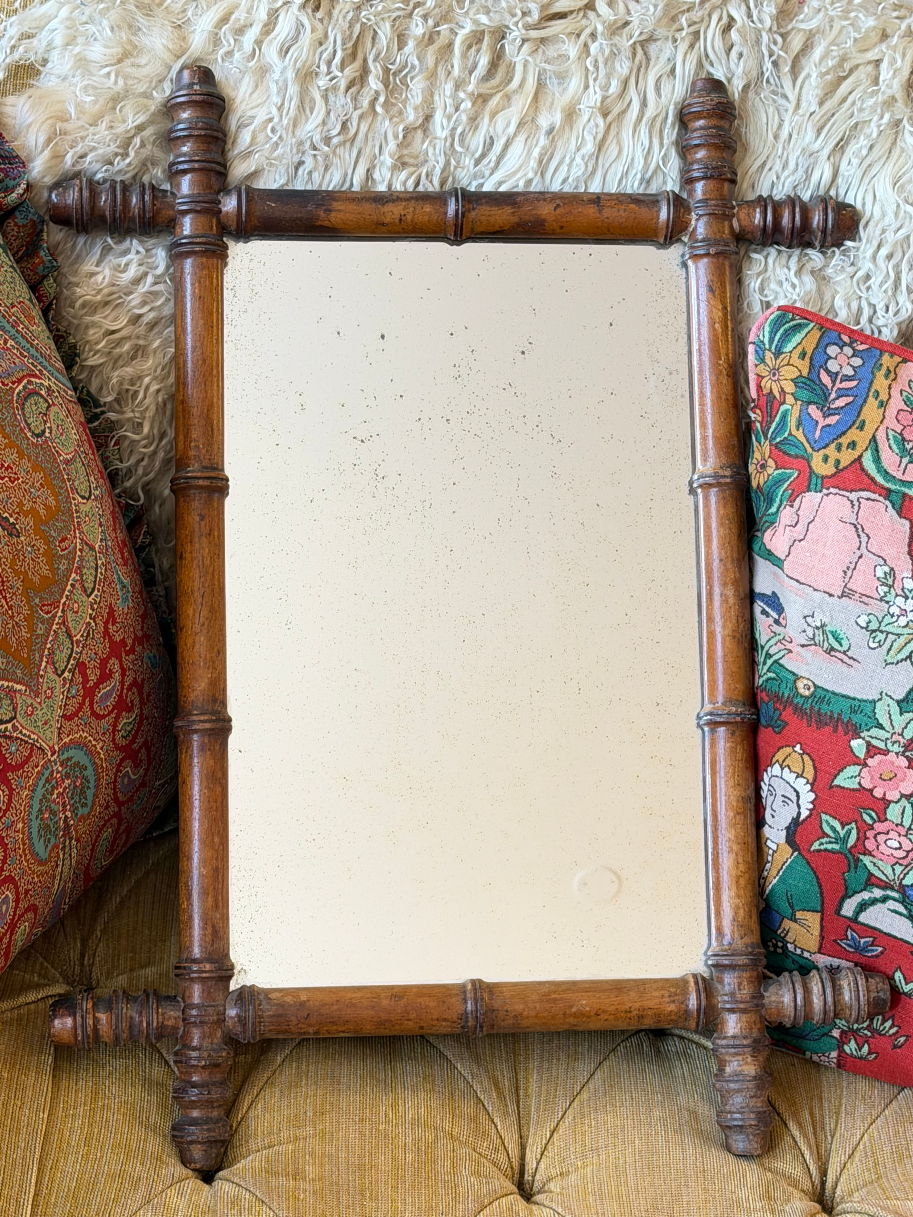 A charming late Victorian walnut wall mirror dating from the late nineteenth cen