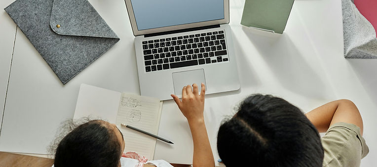 A parent and child working on a computer