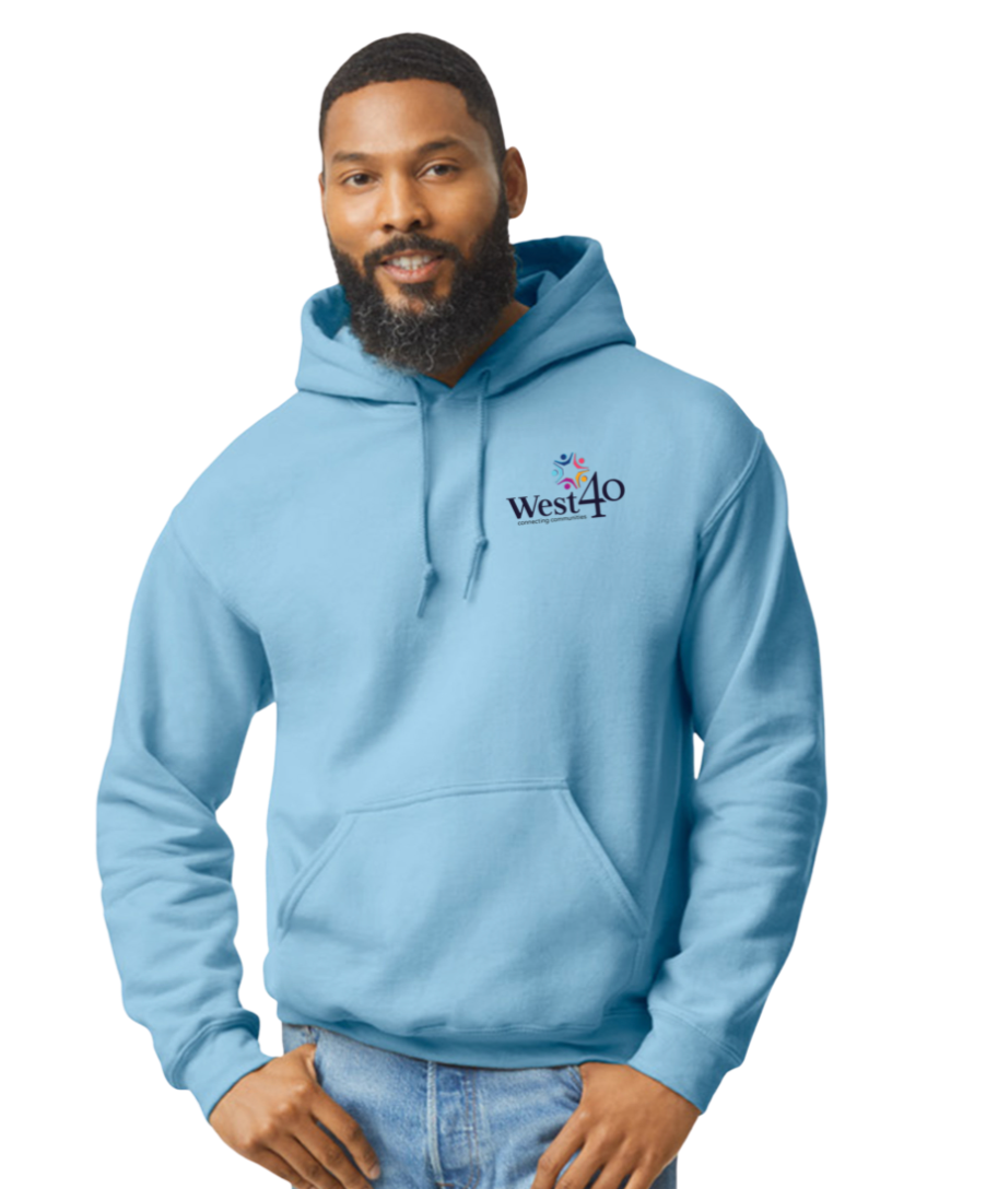 Man wearing light blue hoodie with West40 logo; smiling at the camera.