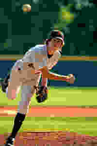 baseball player practising his pitch