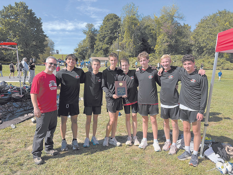 The Fox Lane boys team poses with its plaque after winning the team title at Somers. COURTESY FOX LANE