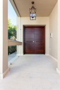 Double door covered with teak wood