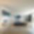 Modern living room with sleek furniture, white walls, and large windows. A digital display and a painting add a futuristic touch.