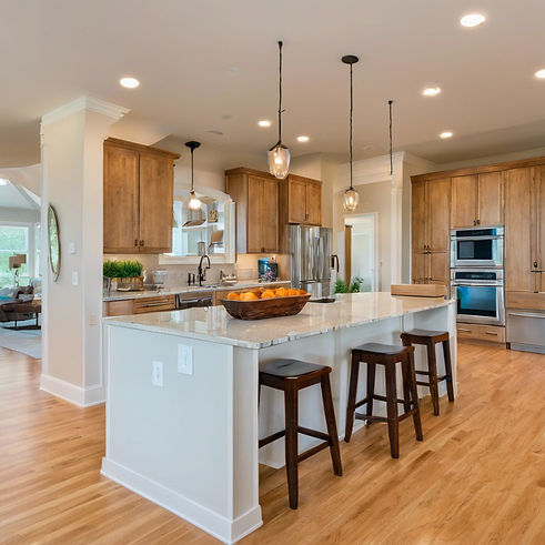 Looking into a living room from the kitchen island with a glass in the picture.jpg