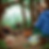 Man in blue hoodie seated in forest observing assorted wildlife including bears, raccoons, and squirrels near scattered food and containers.
