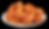 Plate of glazed, golden-brown chicken wings in a pile on a white plate against a black background, creating a mouthwatering appeal.