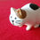 Thumbnail: Tortoiseshell cat  in a scrutinizing posture