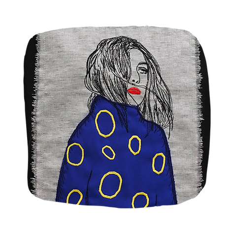 Woman wearing blue clothing decorated with yellow circular patterns, contemporary fashion embroidery