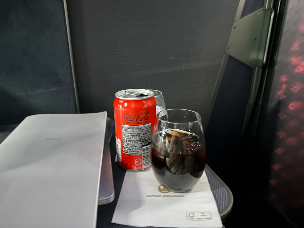 So I did manage to fall asleep for about an hour, and when I woke up, my flat coke was still there. Big deal? No, but most carriers in J would have removed it, along with the plastic from the bedding.