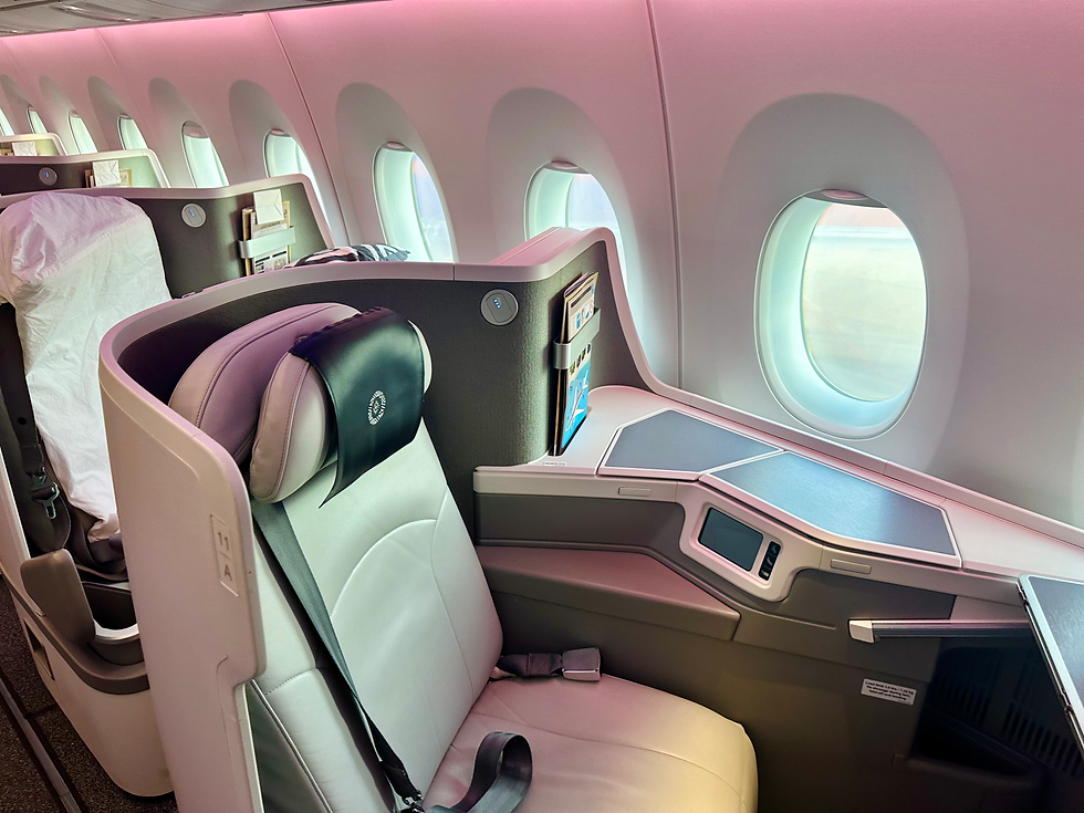 Got some nice leather touches to it. Not my favorite seat in the world due to how constricted your legs are when sleeping, but better than economy. 1200 better than economy? I don't think so...