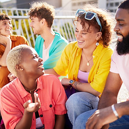 Group of queer folks laughing