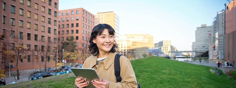 happy-young-brunette-girl-asian-woman-walks-around-city-with-tablet-goes-university-with-h