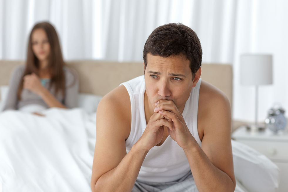 pensive-man-sitting-bed.jpg
