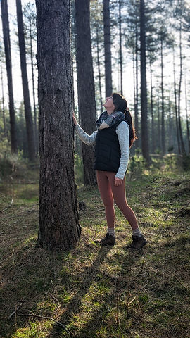 Katie Winder connecting with nature in the forest