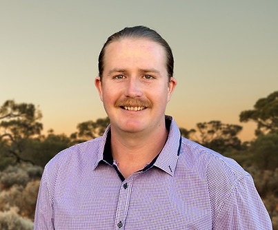 Zac Headshot_W Background.jpg