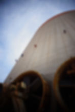 Eye-level view of a rope access technician preparing equipment on a rooftop