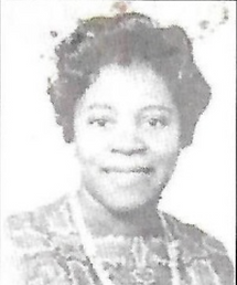 Black and white photo of a smiling woman
