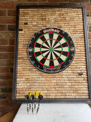 Wine cork backed dart board with oak frame