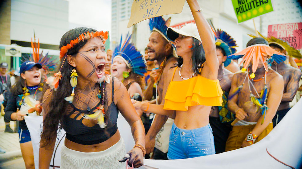 A still from my research filming at COP 30 in Brazil. Protestors sing about their river, Rio Tapajós at a protest march while the conference took place.