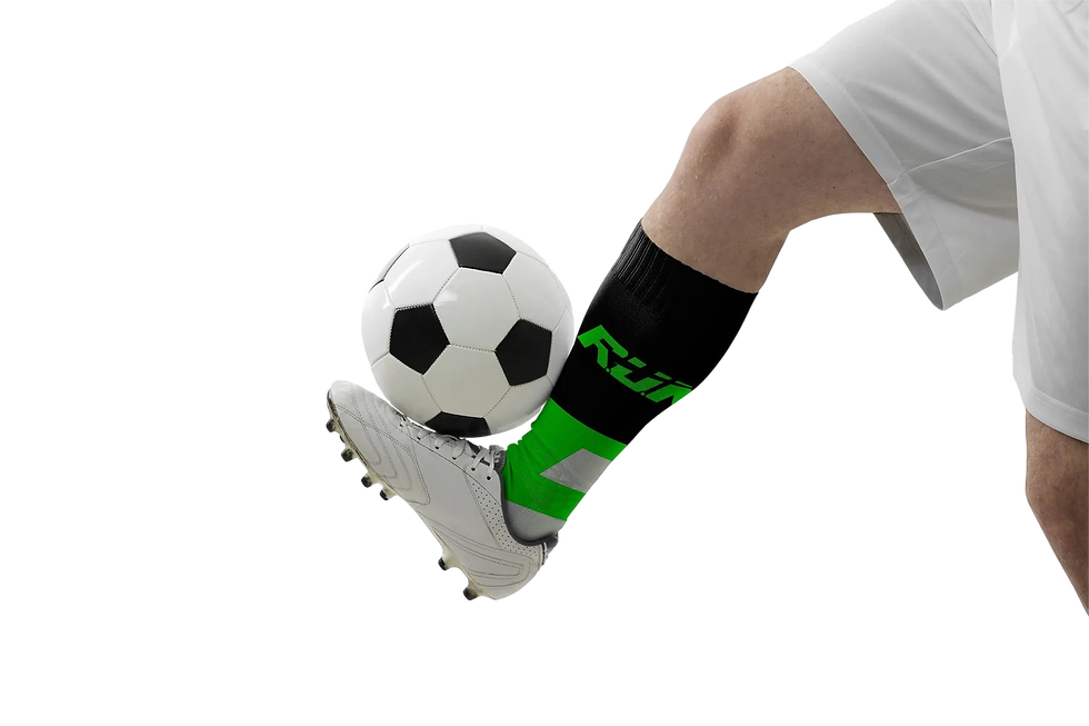 Soccer player in white kit juggling ball, wearing black and neon green RUN-branded sports socks