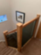 The Stair Specialists Wooden Staircase with Darkened Glass Panels