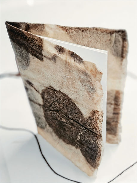 An example of a miniature book using ecoprinted paper towels for the cover.