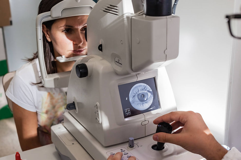 Optometrist using diagnostic equipment to examine the retina