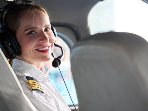 Female Pilot sitting in a cockpit