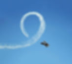 Aerobatics training aircraft performing a flip
