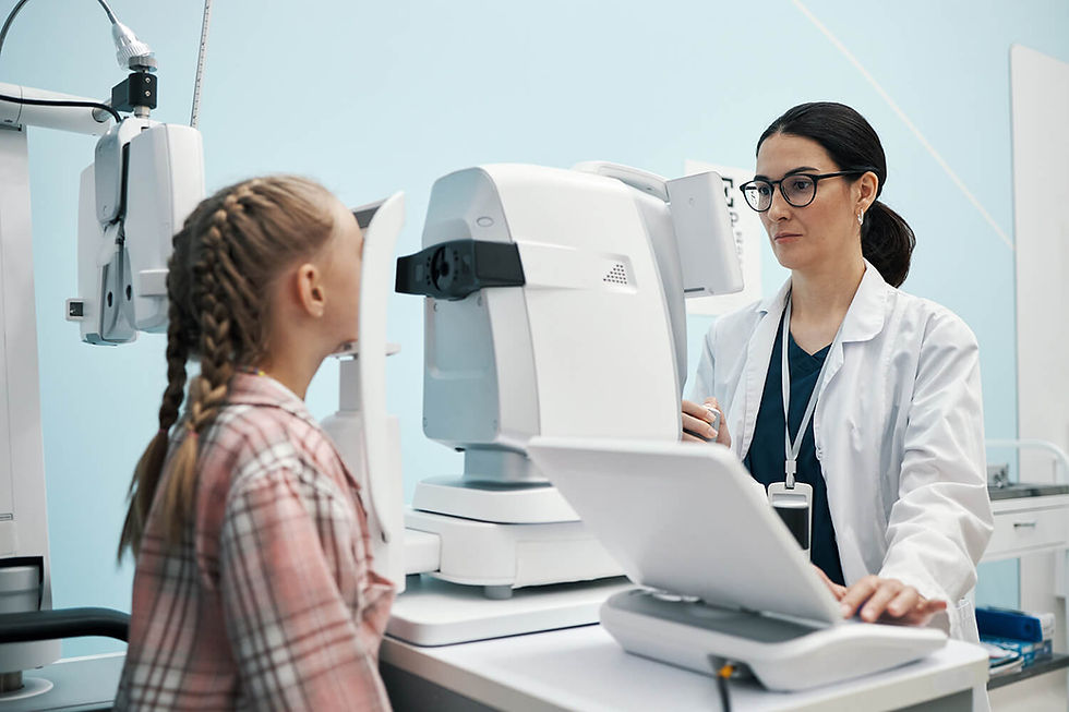 Optometrist examining a child’s eye using diagnostic equipment
