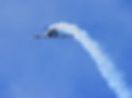 Aerobatics training aircraft performing a flip