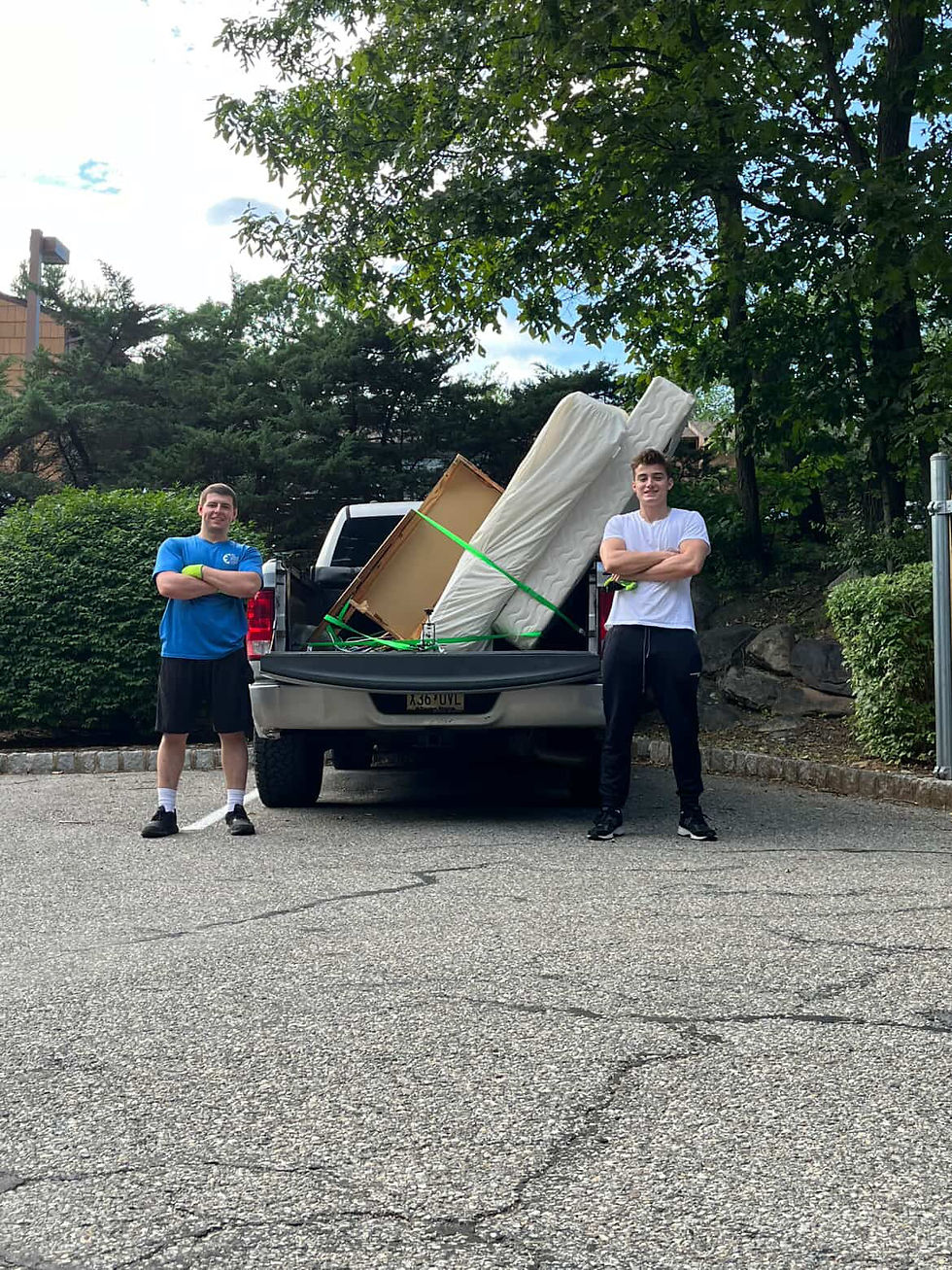 CK Solutions owner Cade Krajcsovics, left, says he is on-call 24/7 to help lighten the load for people or organizations with too much junk. (Photo/CK Solutions)