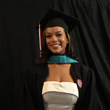 •	“College graduate posing on campus in cap and gown, captured by PJ Photography in Indianapolis” 