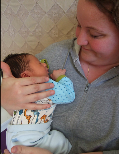 newborn being held