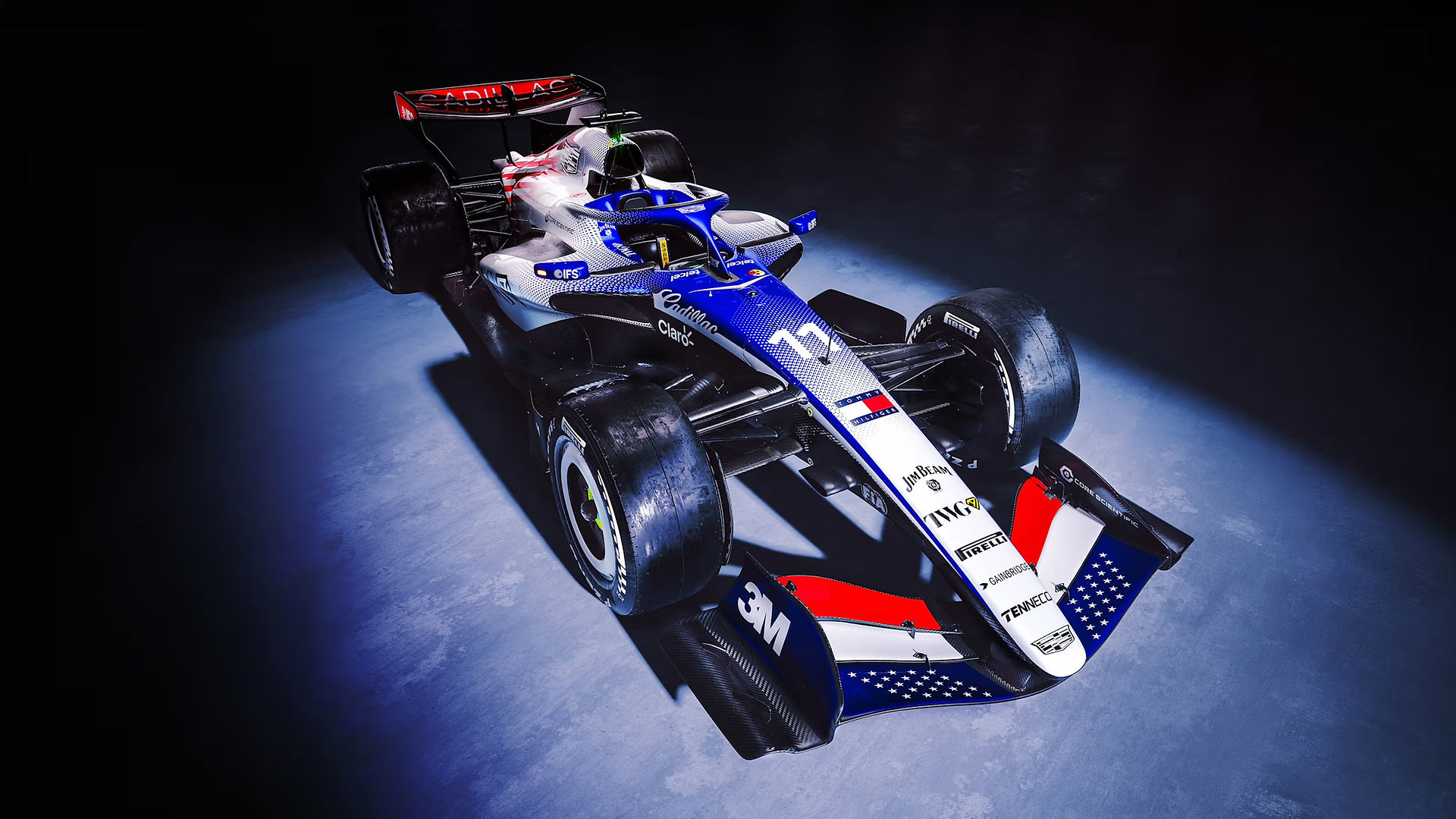 A front-side picture of the Cadillac F1 car in its red, white and blue livery.