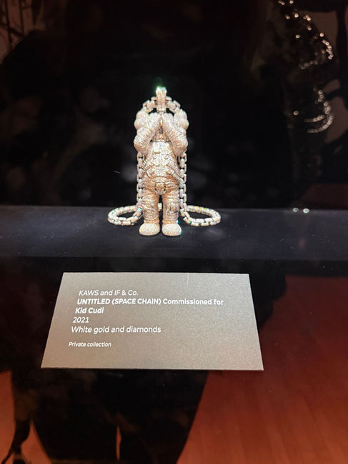 A diamond figurine on a chain for Kid Cudi designed by KAWS