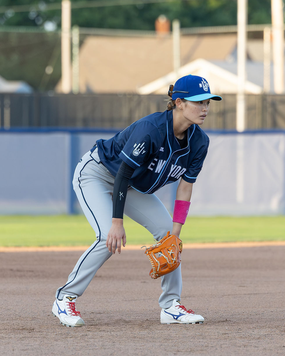 Emi Saiki in a defensive stance at shortstop during a baseball game