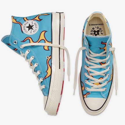 A pair of blue Converse Chuck Taylor hi-tops with flames designed by Tyler, The Creator