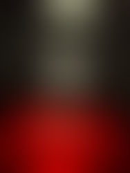 A black room with the words "Los Angeles Wants It All" in red on the floor and Jordan VI Infrared "Salesman" sneakers in a glowing white triangle display