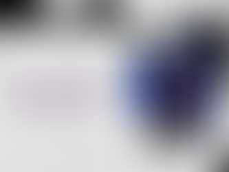 A graphic with a gray rectangle on the left with the words "Drip Check" in purple and a photo of Lu Dort in an NBA Tunnel on the right wearing a brown jacket and burgundy pants