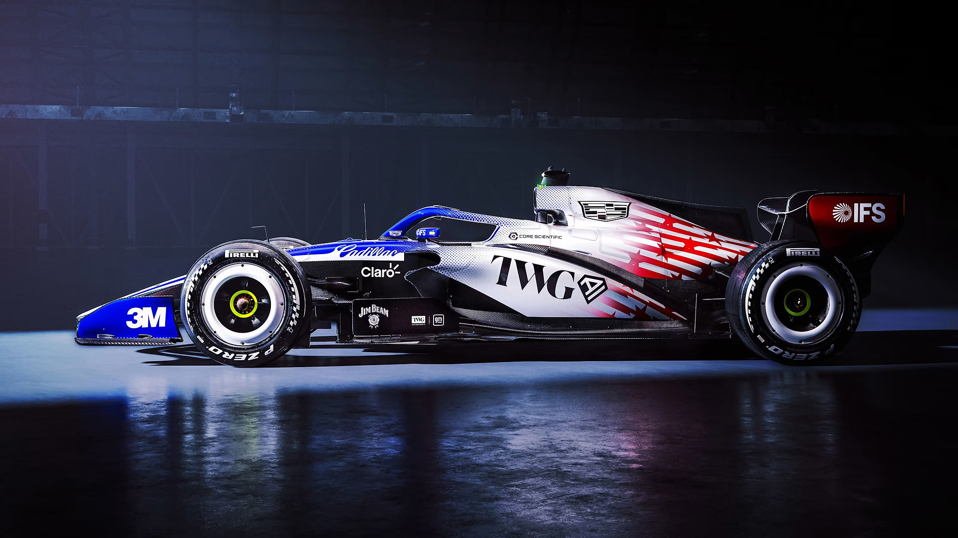 A side view of the Cadillac F1 car in its red, white and blue livery.