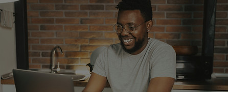 Happy man on a laptop