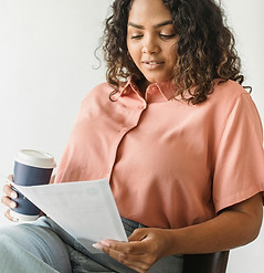 woman reading a paper