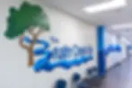 Brushy Creek community center hallway logo mural hand painted by mural artist Texas