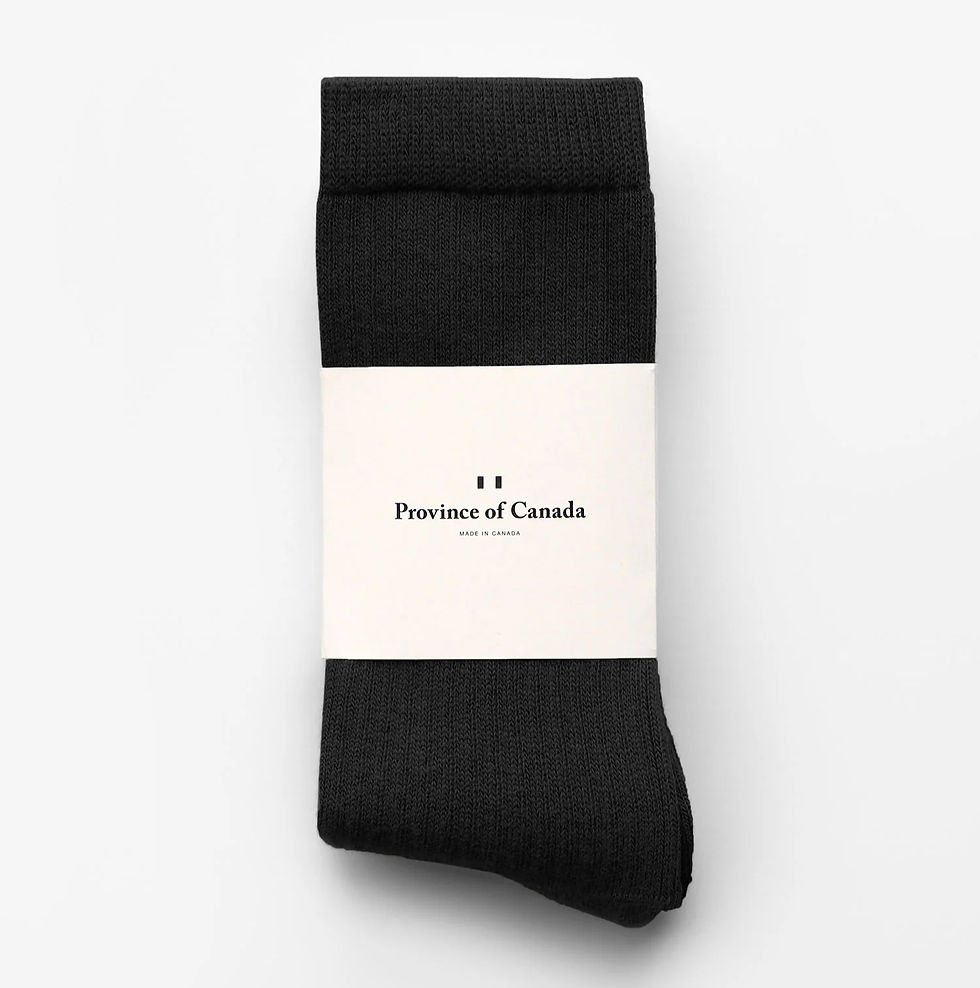 Black socks with a white label reading "Province of Canada, Made in Canada" on a plain white background.