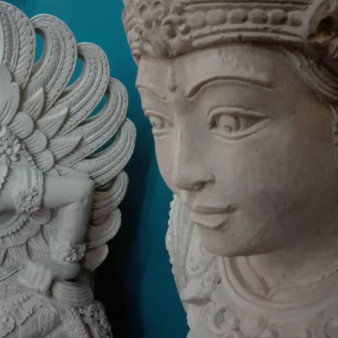 Balinese carved stone statues in a shop.